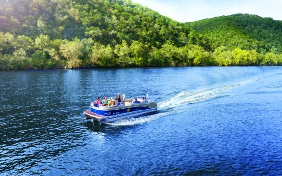 pontoon party boat cruising on Lake Austin