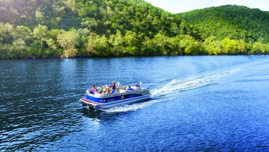 pontoon party boat cruising on Lake Austin